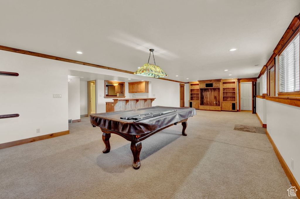 Game room with light carpet, billiards, and ornamental molding