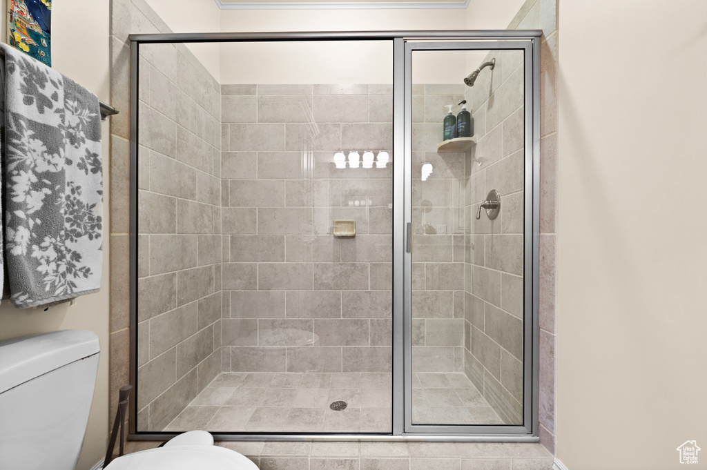 Bathroom with an enclosed shower and toilet