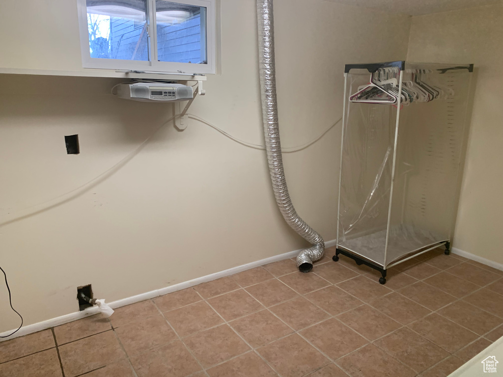 Laundry area featuring tile flooring