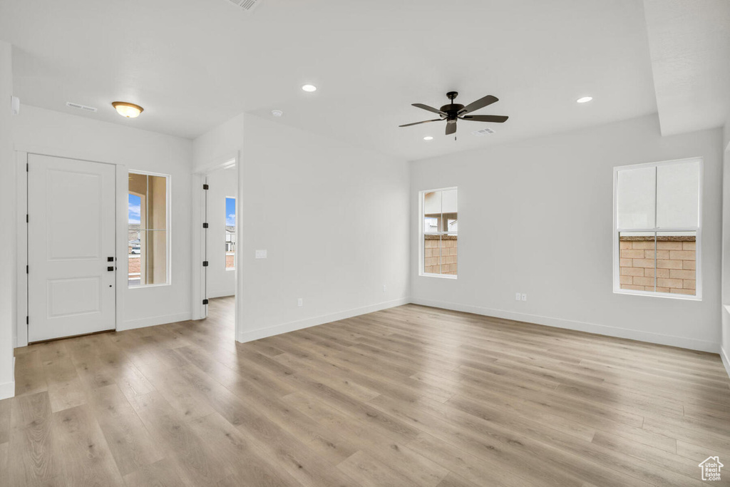 Entryway featuring ceiling fan and light hardwood / wood-style flooring