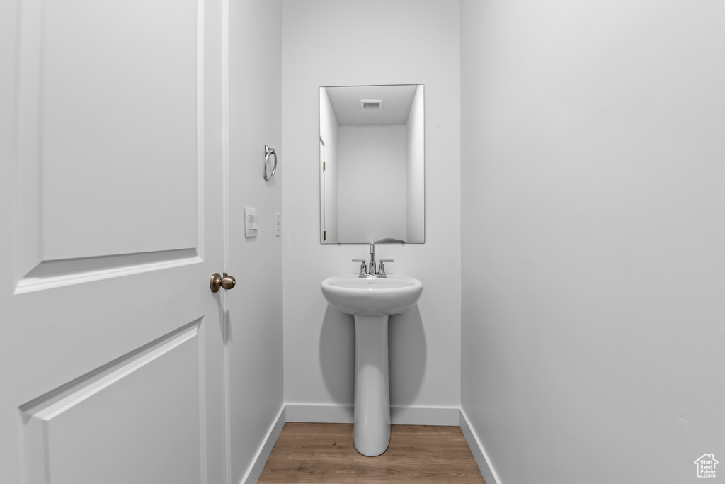 Bathroom featuring hardwood / wood-style floors