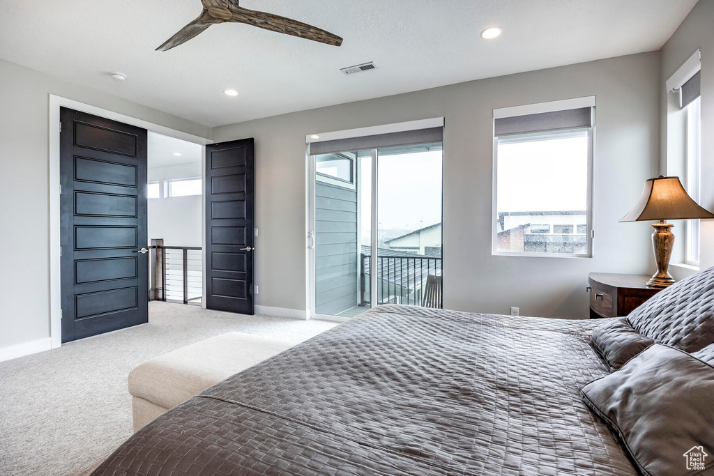 Bedroom with access to exterior, ceiling fan, and carpet