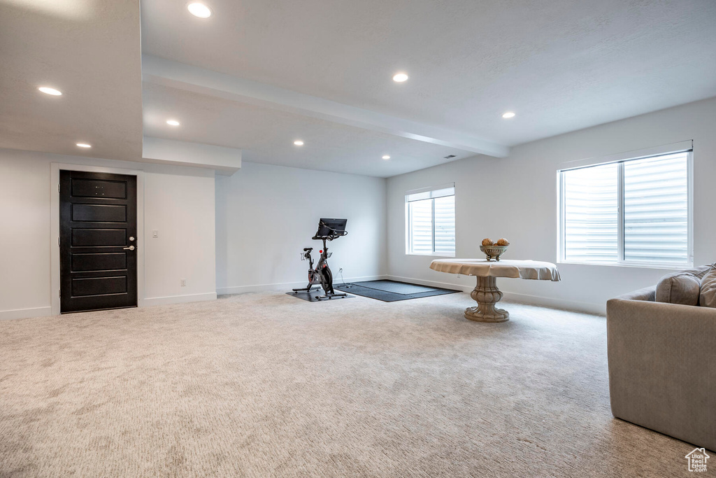Exercise area featuring light colored carpet