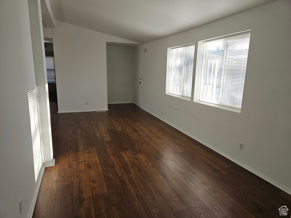 Spare room featuring dark hardwood / wood-style flooring