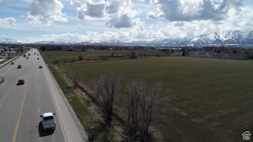 Property view of mountains with a rural view