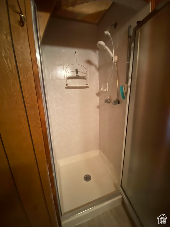 Bathroom with a shower with shower door