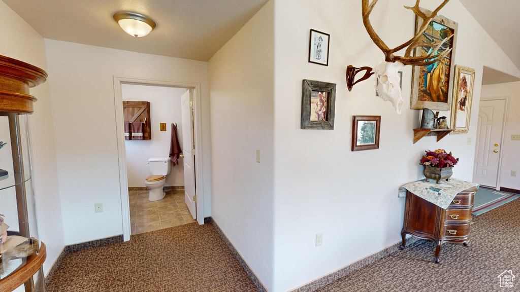 Hallway with light colored carpet