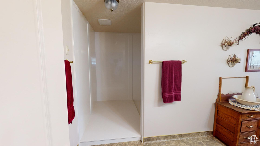 Bathroom featuring vanity and tile flooring