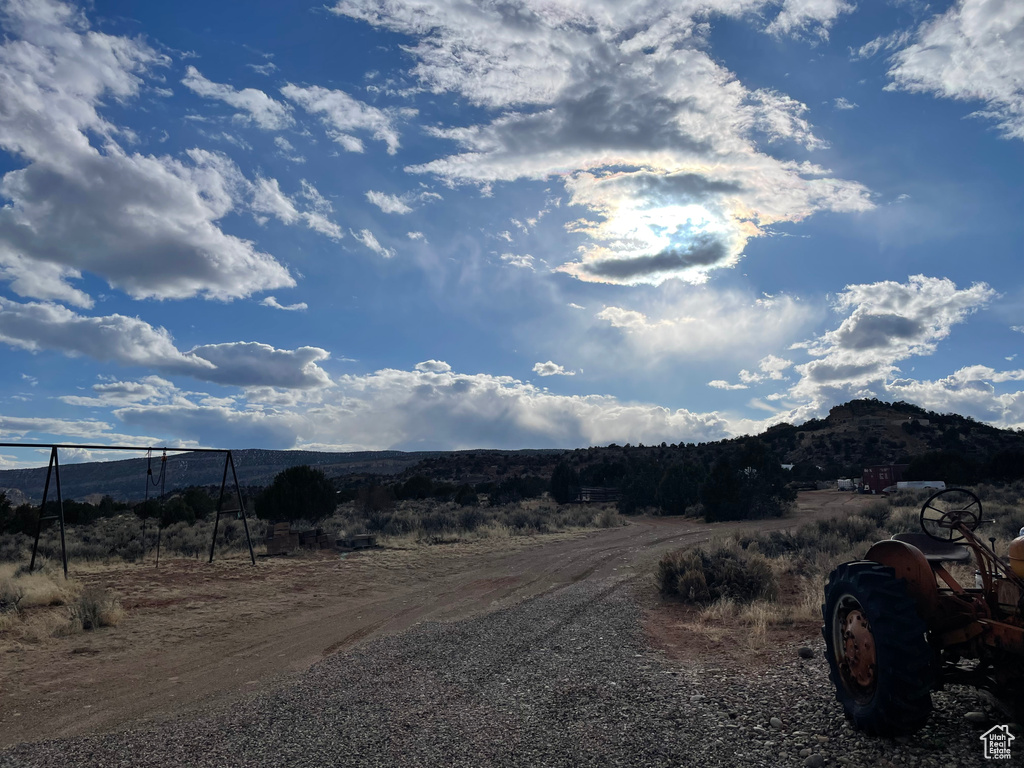 View of street with a mountain view and a rural view