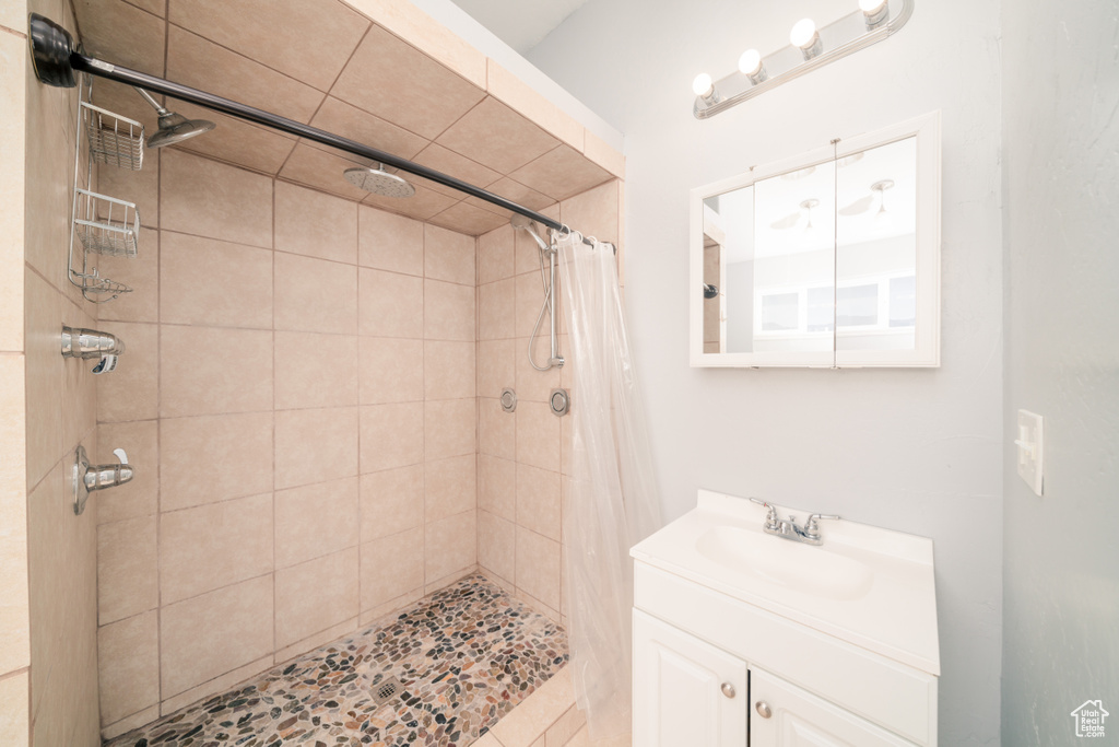 Bathroom with walk in shower and large vanity