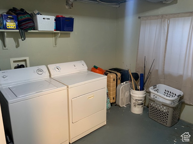 Washroom featuring washing machine and clothes dryer and hookup for a washing machine