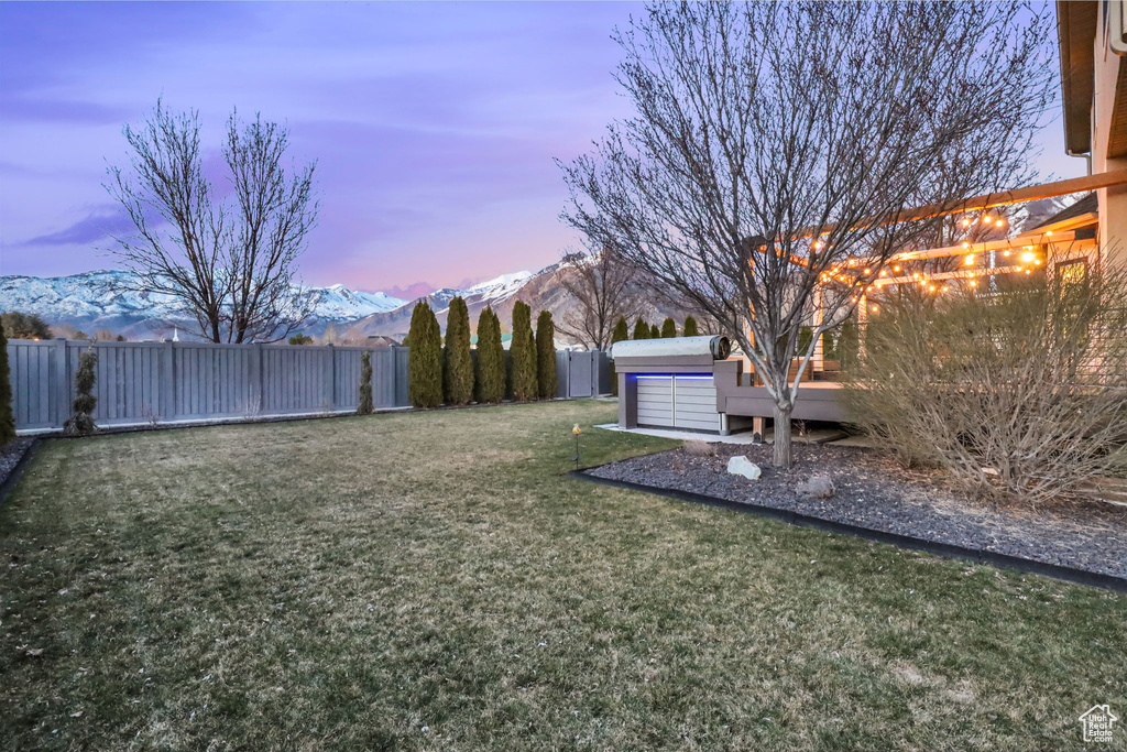 Yard at dusk with a mountain view