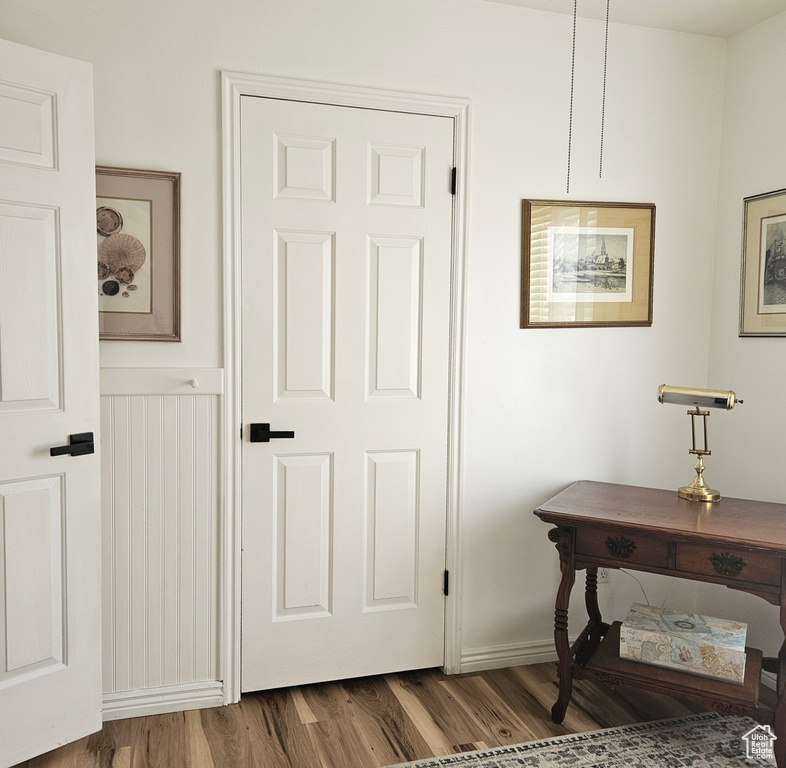Interior space with dark hardwood / wood-style flooring