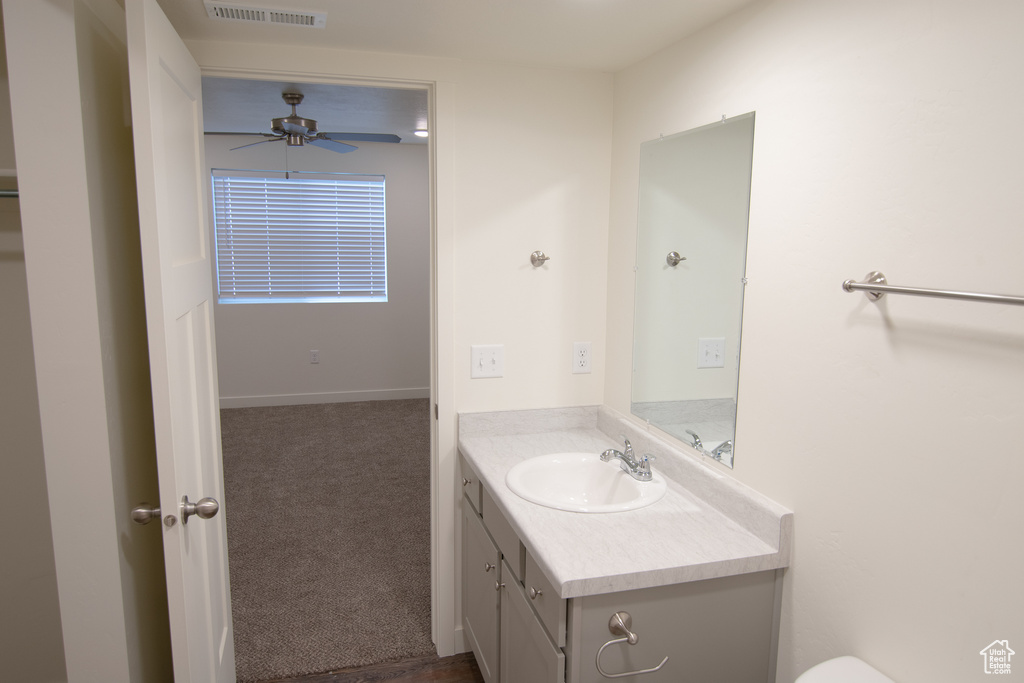 Bathroom featuring vanity and ceiling fan