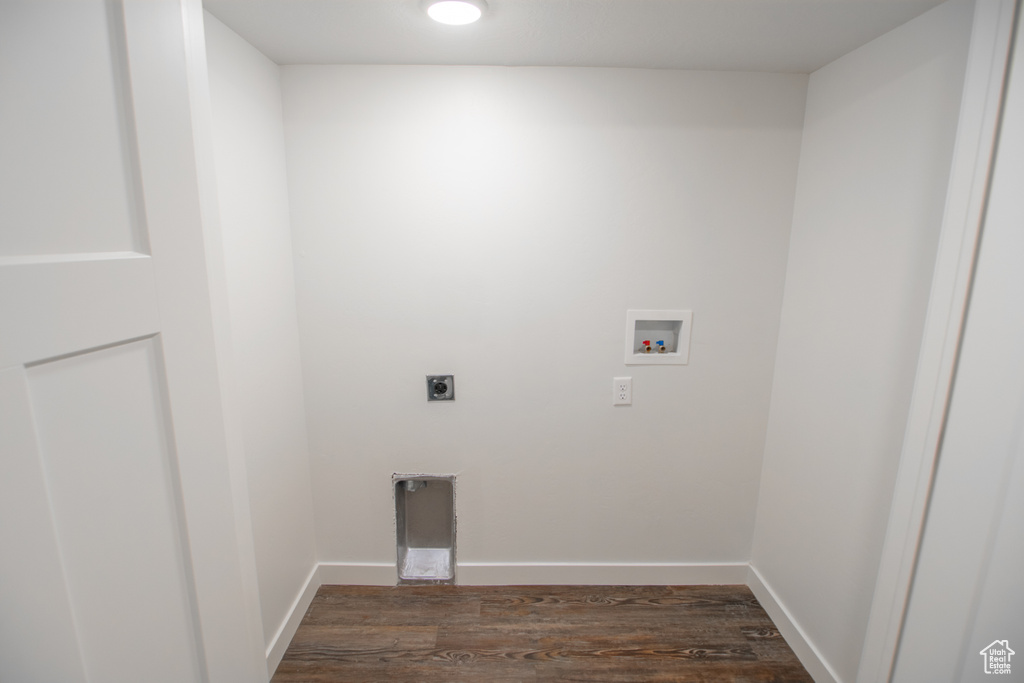 Washroom with washer hookup, electric dryer hookup, and dark hardwood / wood-style flooring
