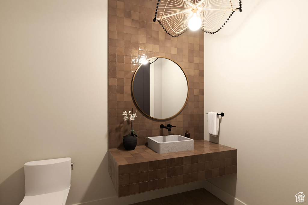 Bathroom with vanity and tile walls