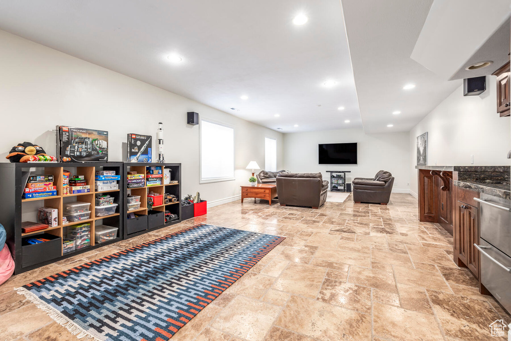 Rec room with light tile floors
