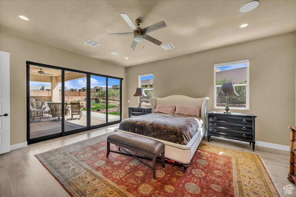 Bedroom with access to outside, light hardwood / wood-style floors, and ceiling fan