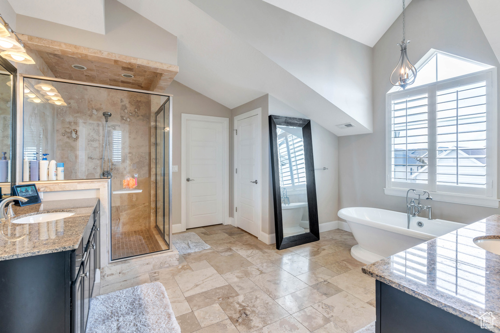 Bathroom featuring plus walk in shower, tile floors, and oversized vanity