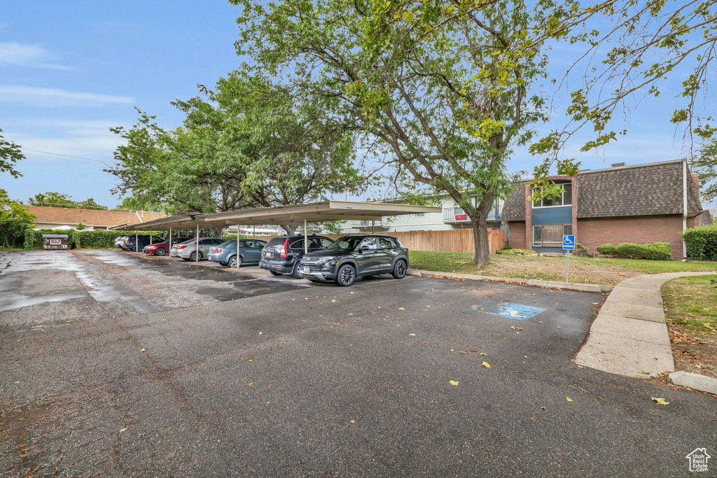 View of car parking featuring a carport