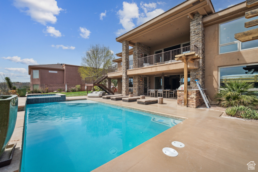 View of pool featuring an in ground hot tub and a patio