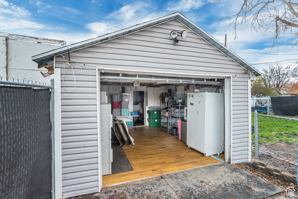 Garage with white fridge