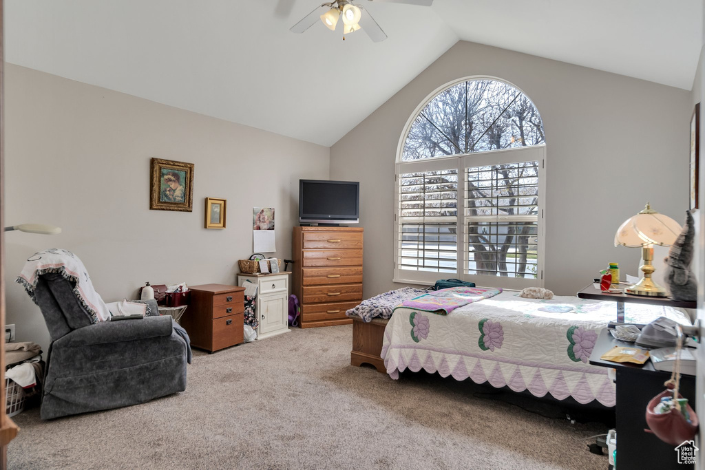 Bedroom featuring light colored carpet, ceiling fan, and lofted ceiling