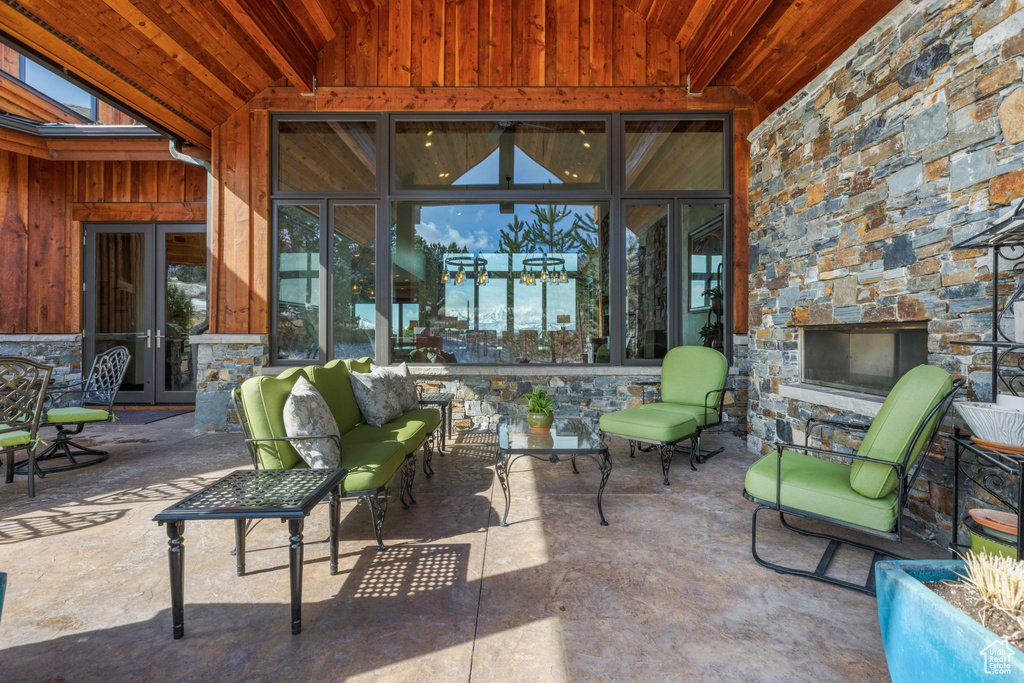 View of patio / terrace with french doors and a fireplace
