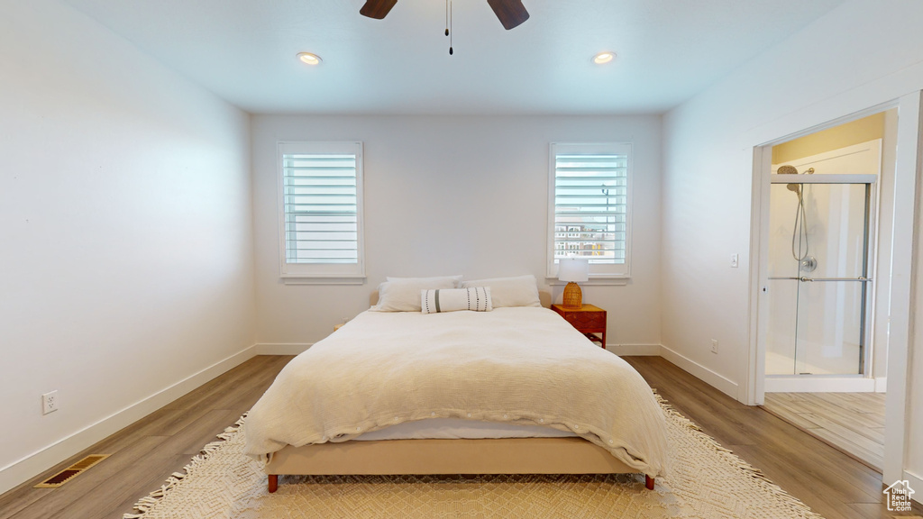Bedroom with ceiling fan and light hardwood / wood-style flooring
