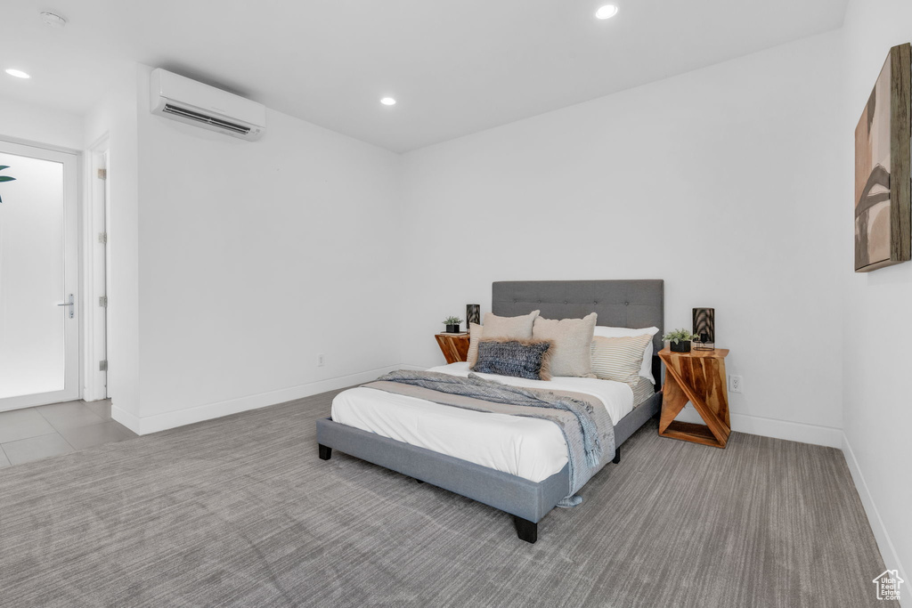 Bedroom with a wall mounted AC