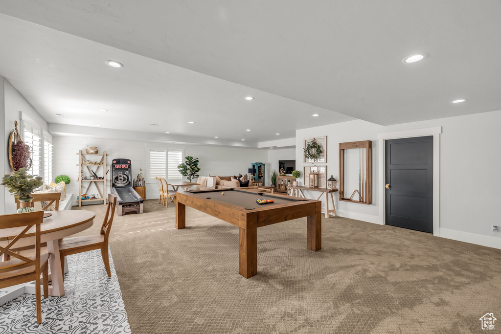 Rec room featuring light colored carpet, pool table, and a wealth of natural light