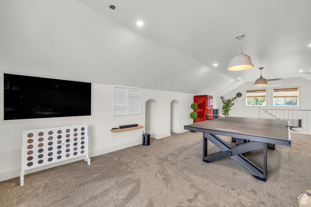 Game room with light carpet and lofted ceiling