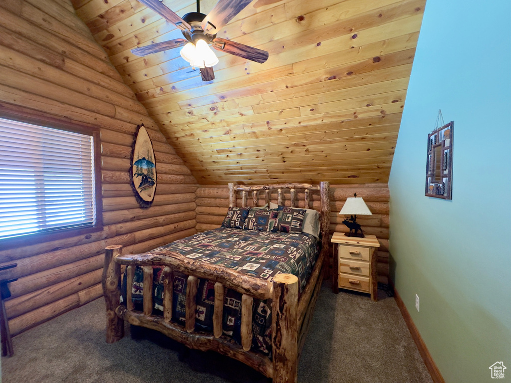 Bedroom featuring wood ceiling, dark carpet, vaulted ceiling, and log walls