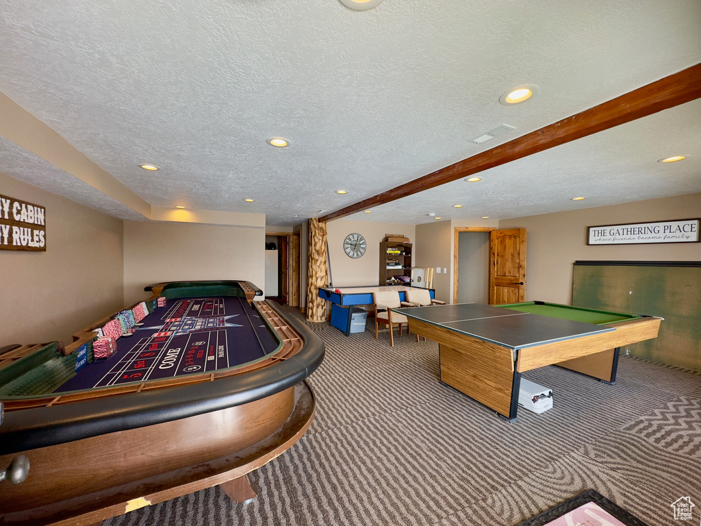 Recreation room with billiards, a textured ceiling, and carpet