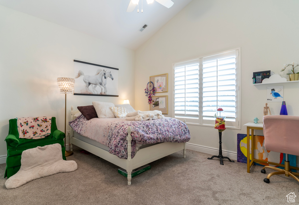 Bedroom featuring high vaulted ceiling, light colored carpet, and ceiling fan