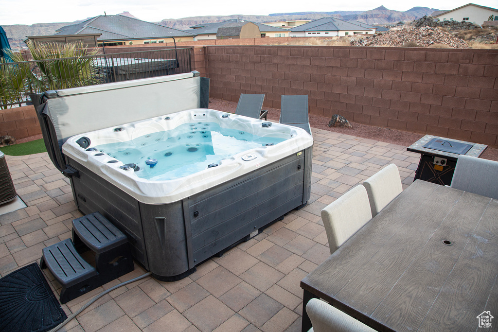 View of patio / terrace featuring a hot tub