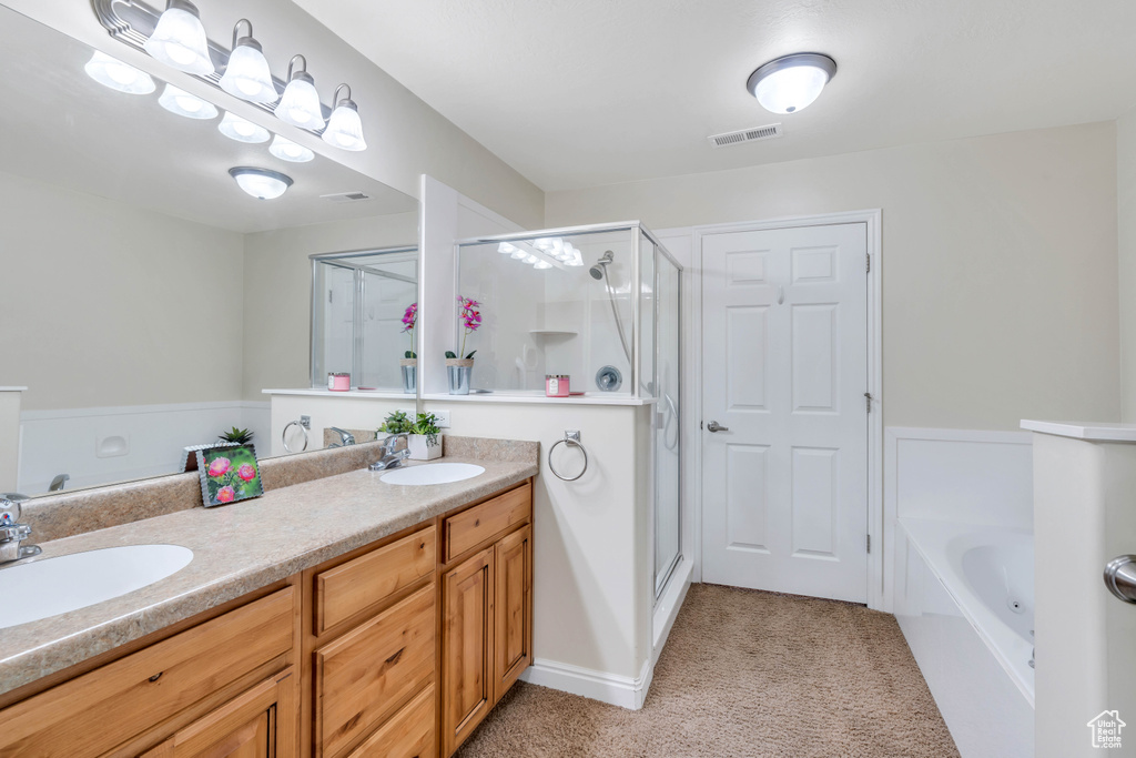 Bathroom with double sink vanity and plus walk in shower
