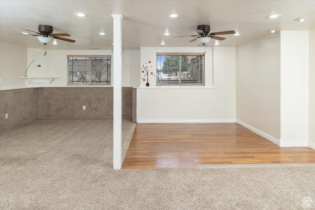 Interior space with ceiling fan and light wood-type flooring
