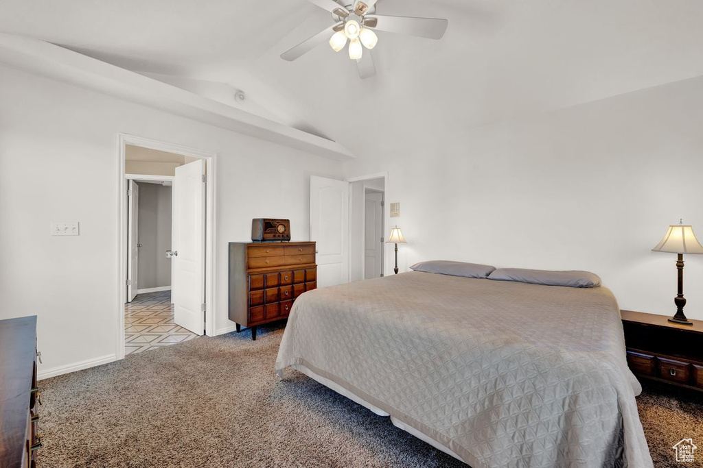 Bedroom featuring high vaulted ceiling, ceiling fan, and light tile floors