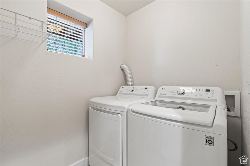 Laundry room featuring washer hookup and washer and clothes dryer