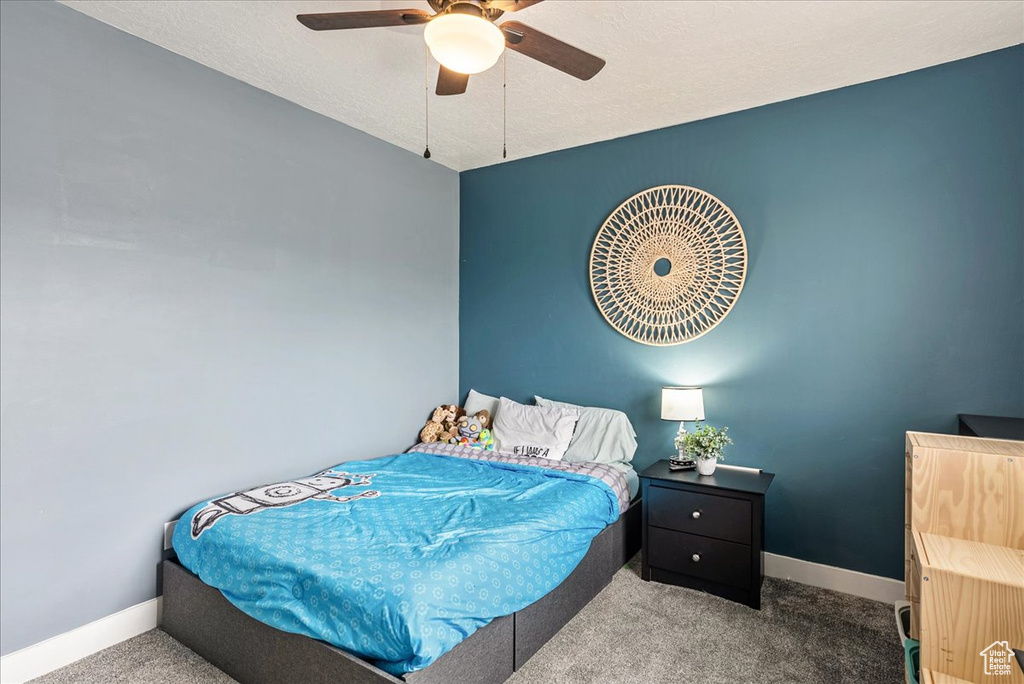 Bedroom with carpet floors and ceiling fan