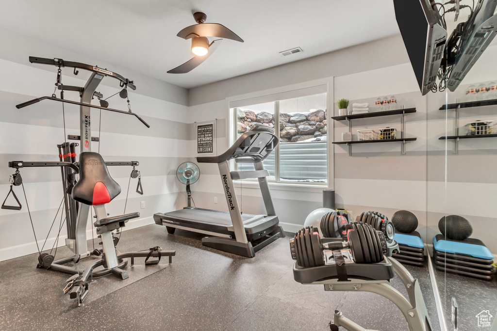 Exercise room with billiards and ceiling fan