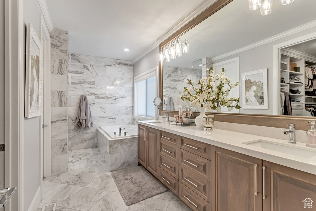Bathroom with plus walk in shower, tile floors, large vanity, and ornamental molding