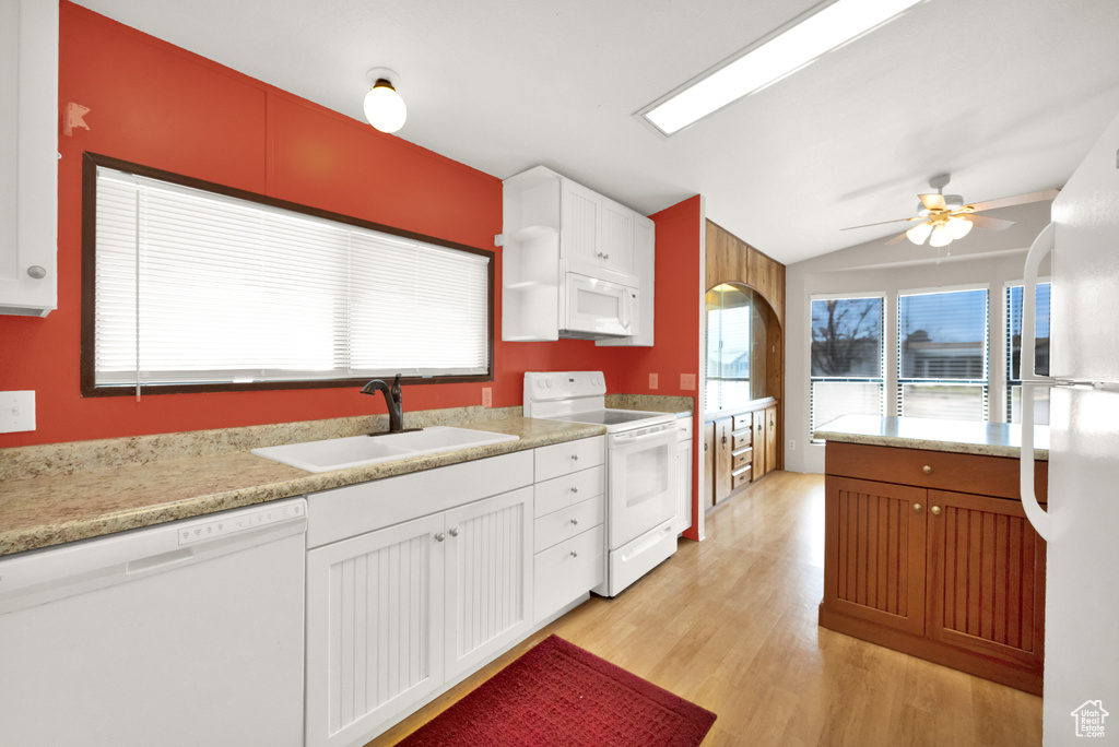 Kitchen featuring ceiling fan, light hardwood / wood-style flooring, white appliances, white cabinets, and sink