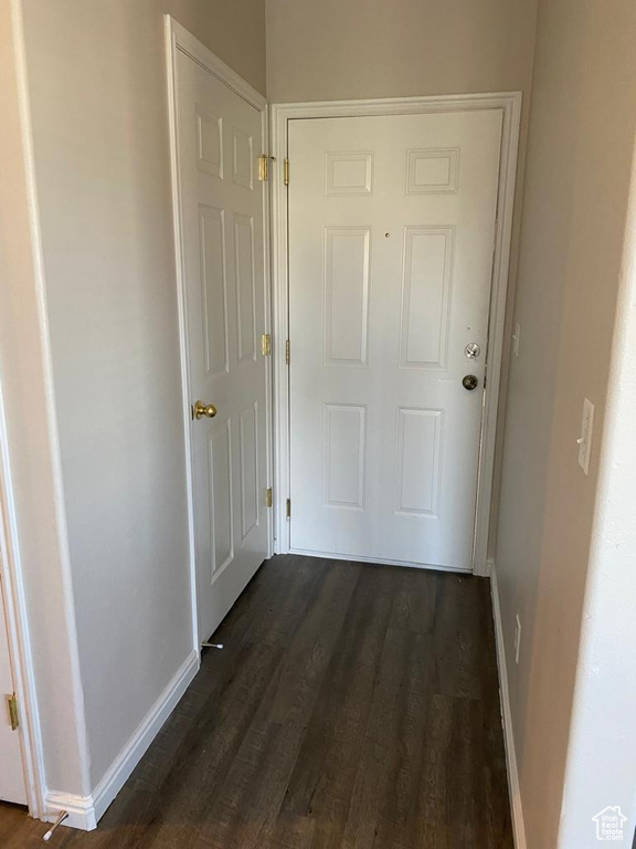 Hallway featuring dark hardwood / wood-style floors