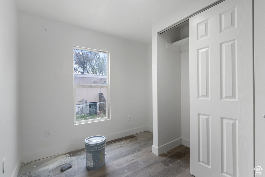 Bathroom with a wealth of natural light and hardwood / wood-style flooring
