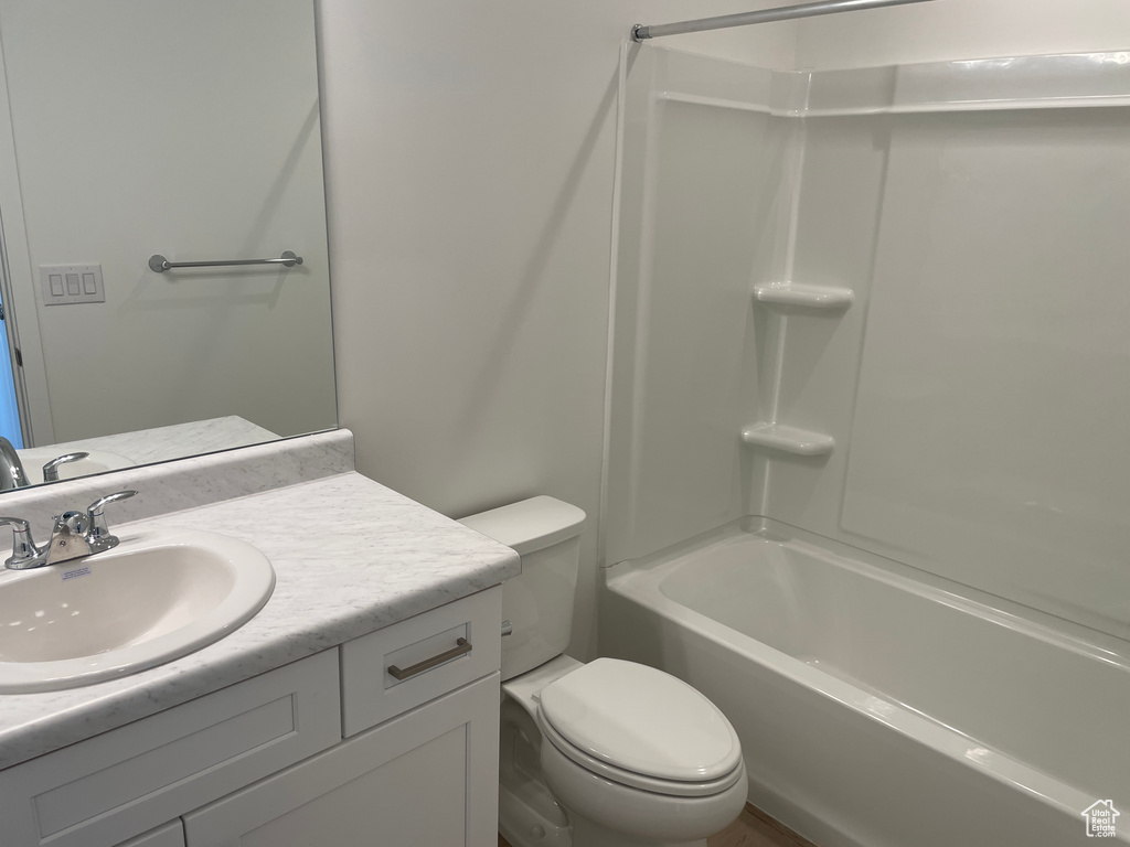 Full bathroom featuring toilet, shower / bath combination, and oversized vanity