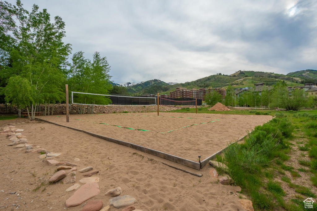 View of property's community with a mountain view and volleyball court