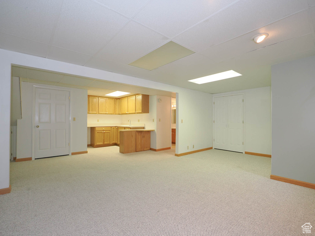 Unfurnished living room with light colored carpet