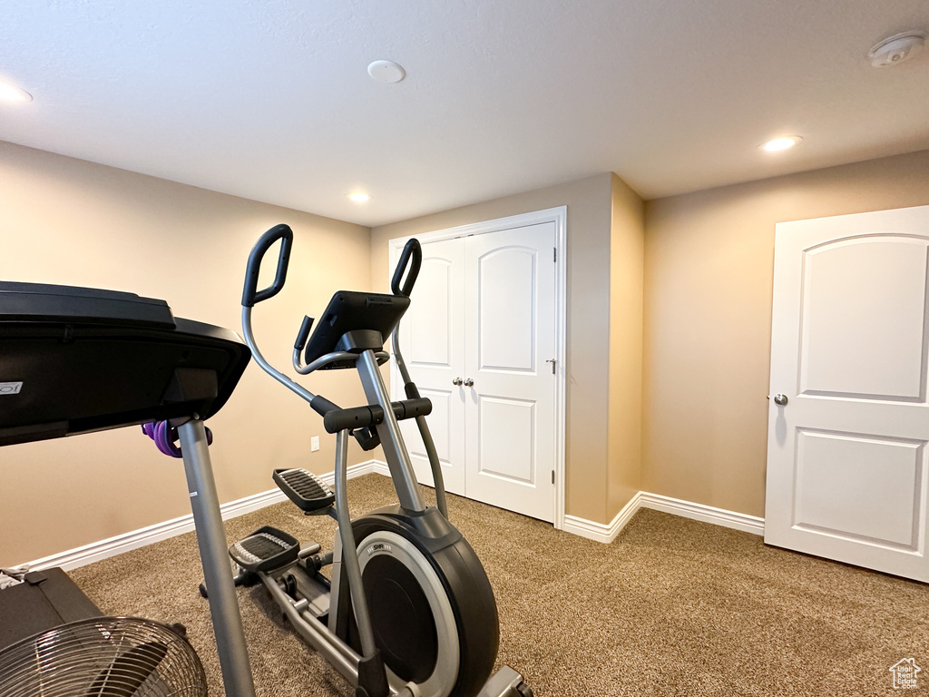 Workout room with dark carpet